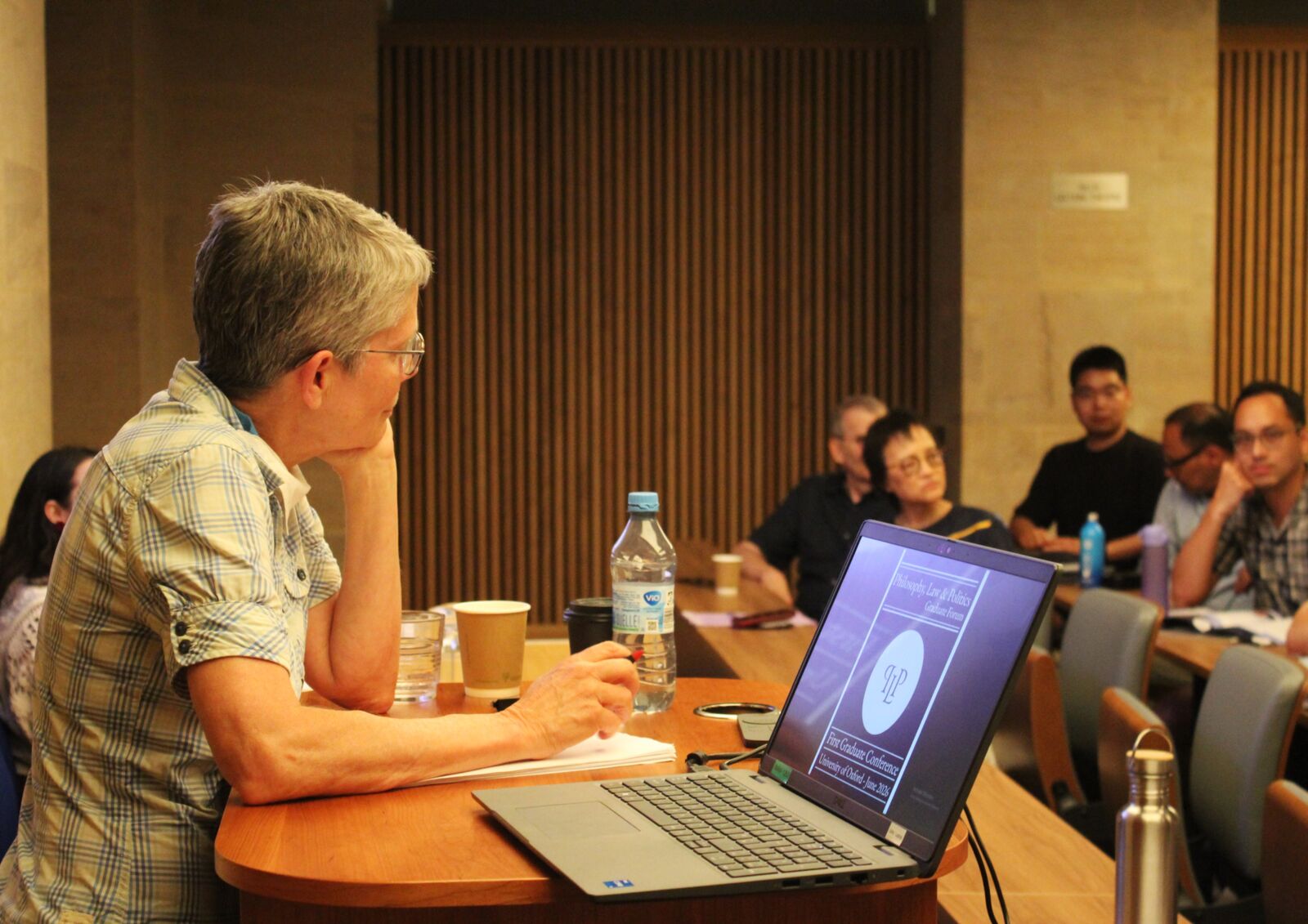 A graduate speaker presenting a paper