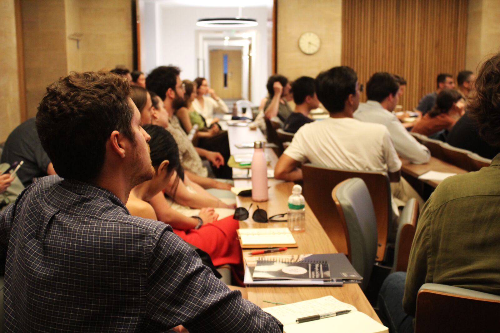 Faculty and graduate students in discussion